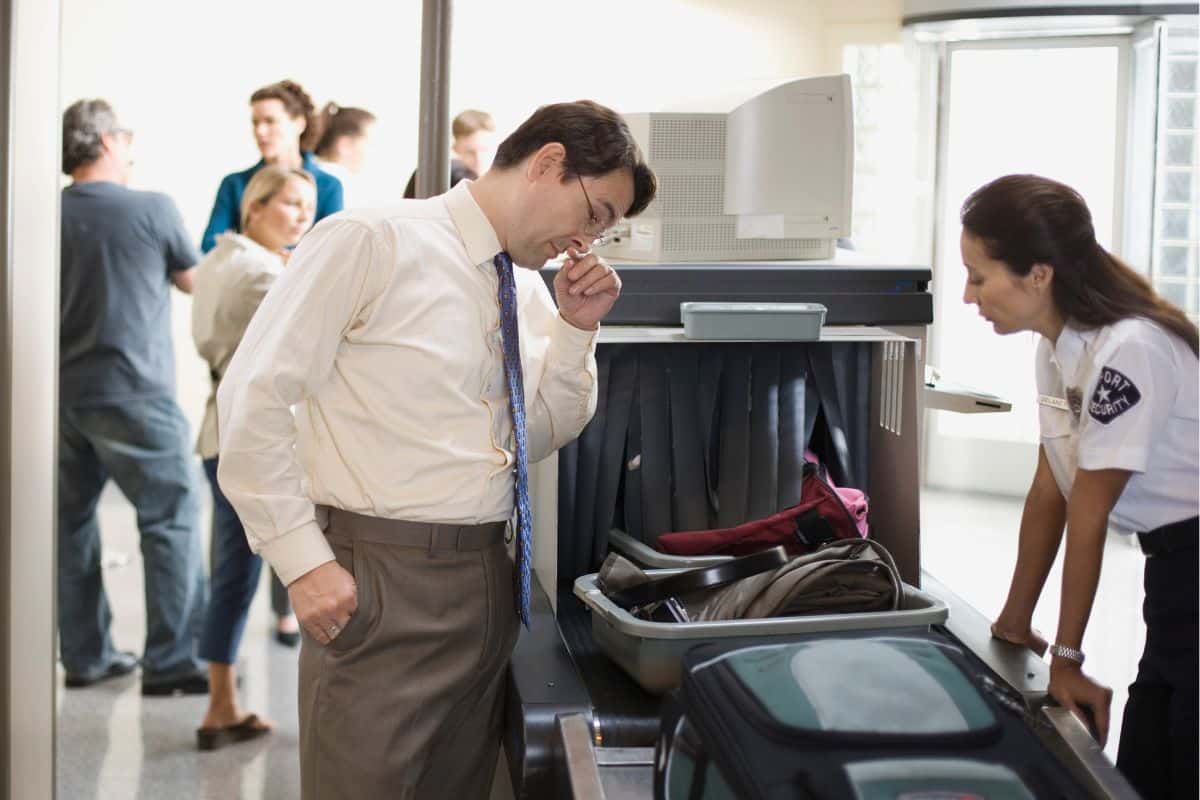A man getting checked at the airport