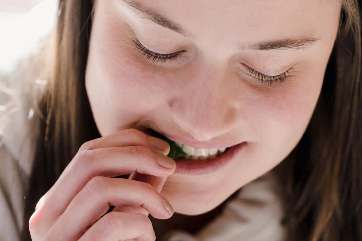 A woman having delta 9 gummies and having fun