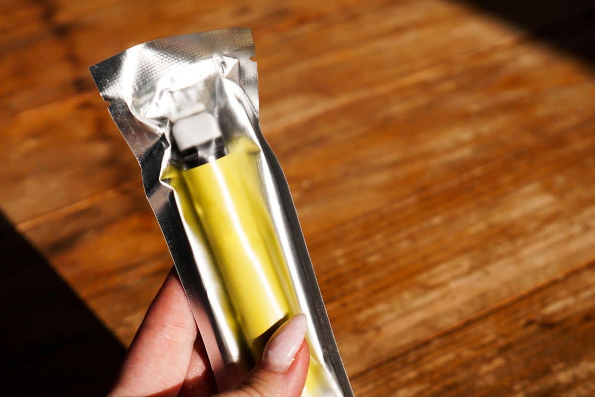 A woman holding brand new ELF bar in her hand
