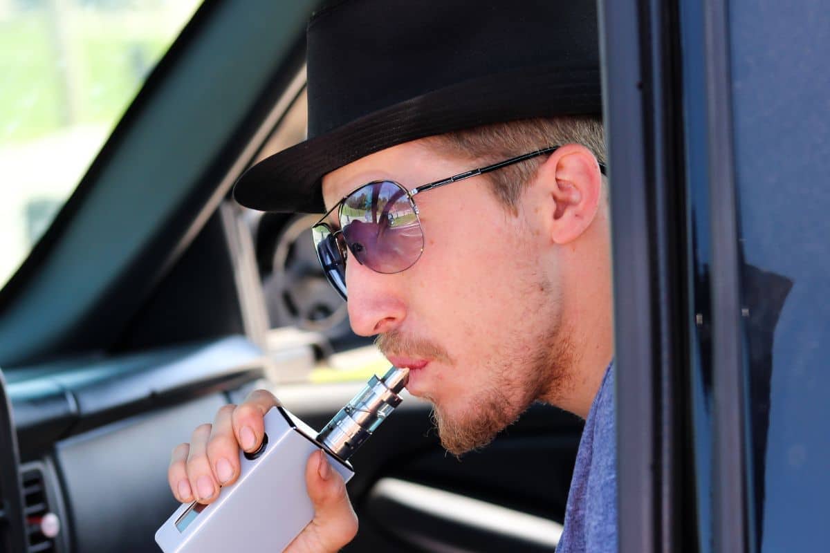 A guy inhaling deeply for maximum satisfaction 