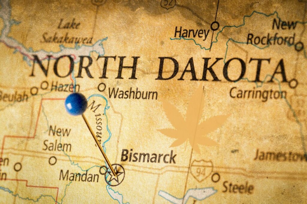 North dekota map and marijuana leaf on it